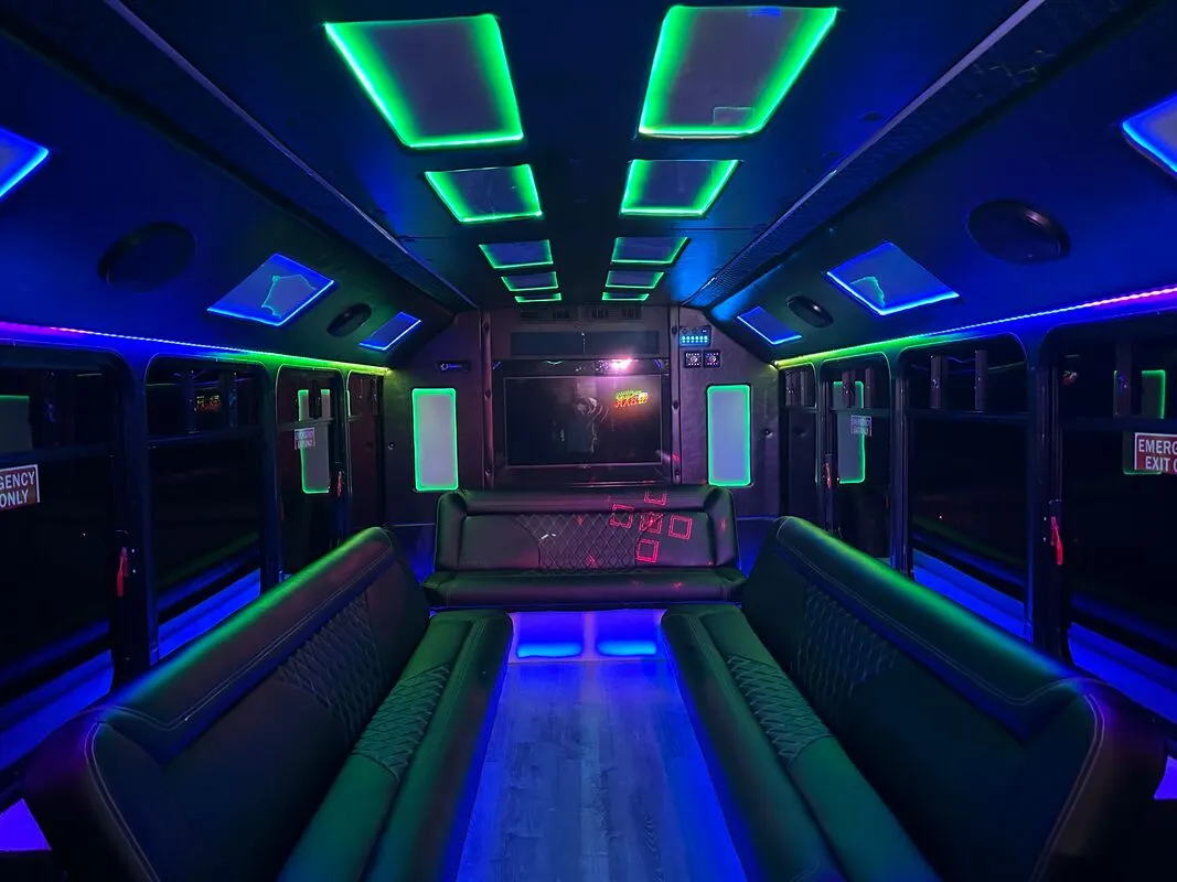 Ford E-450 Series Party Bus Ford E-450 Series Party Bus interior with perimeter lounge seating, LED accent lighting and LED ceiling lighting for party bus rental
