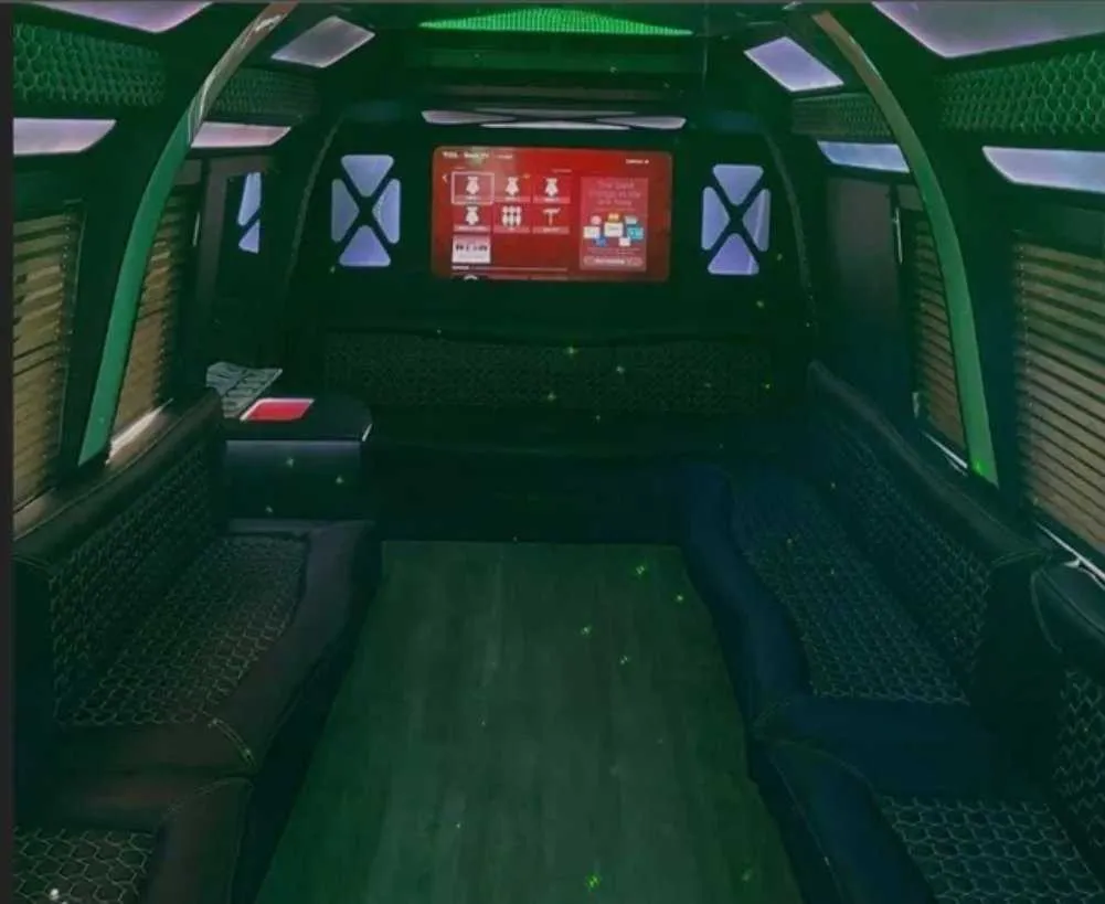 D-Town Bus D-Town Bus interior with perimeter lounge seating, window shades and LED accent lighting for party bus rental