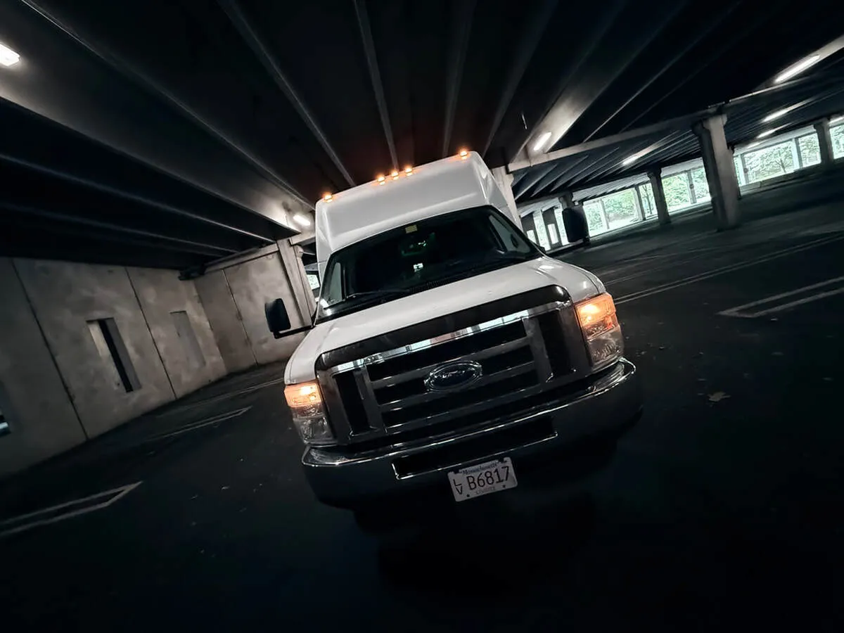 White Ford E-450 Series Party Bus exterior for party bus rental