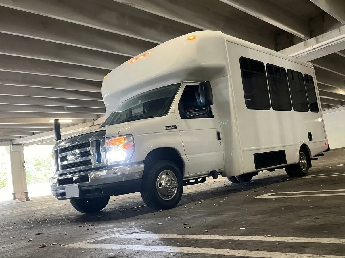 Ford E-450 Series Party Bus in white, available to rent