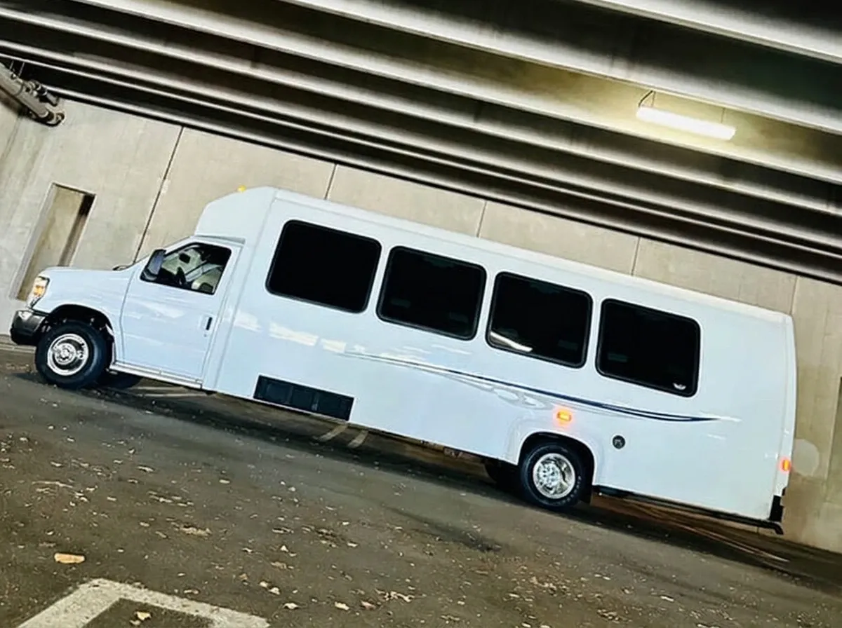 Ford E-450 Series Party Bus in white, available to rent