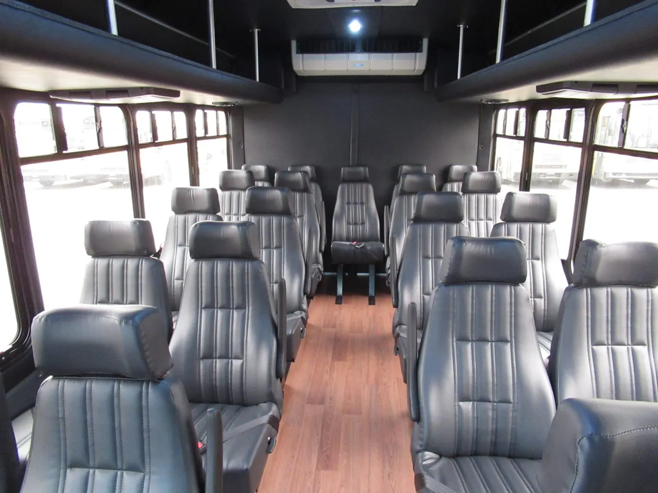 Ford E450 Executive VIP Shuttle Bus (24 Passengers) Ford E450 Executive VIP Shuttle Bus (24 Passengers) interior with wood-look flooring for minibus rental