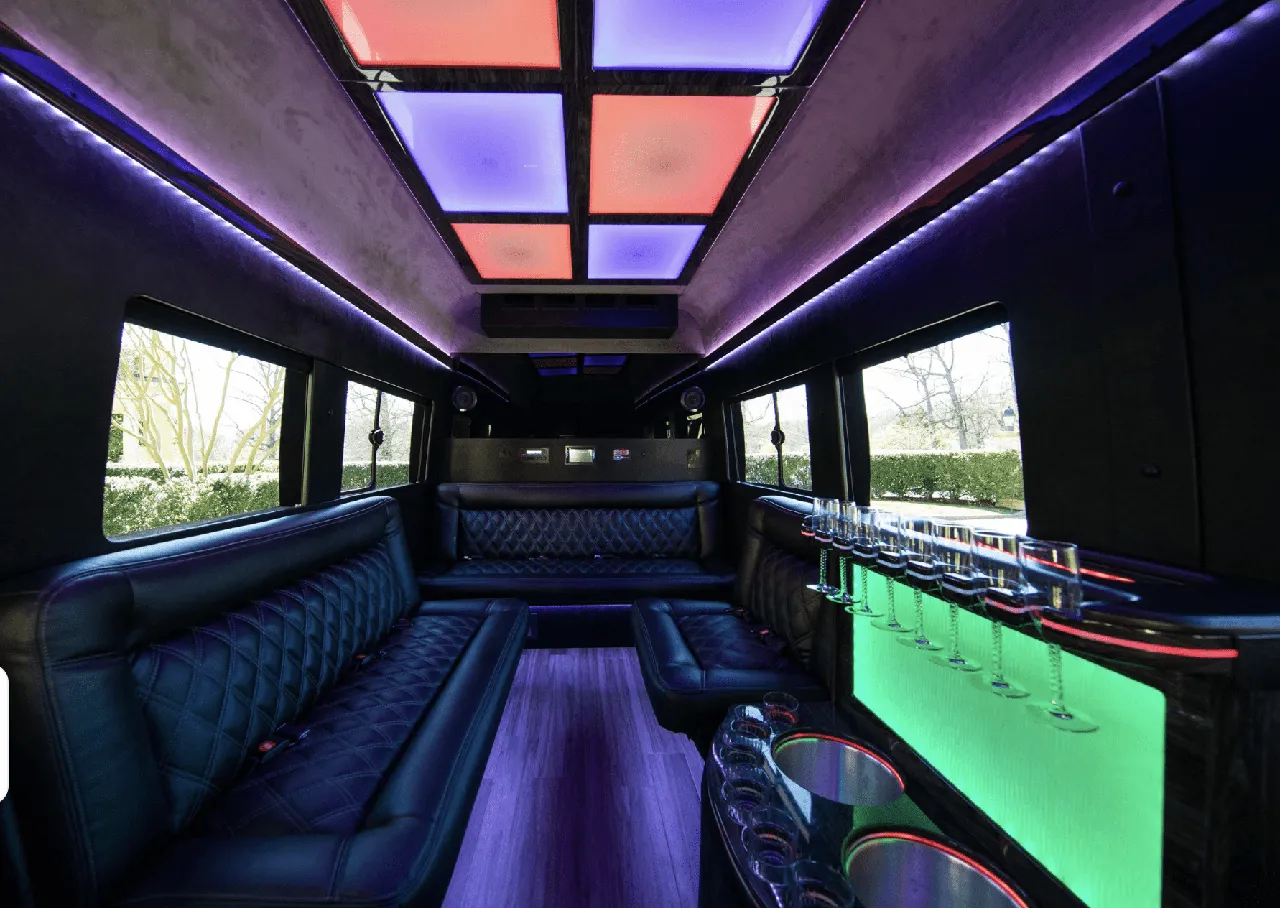 Ford Limousine Van Ford Limousine Van interior with sofa-style seating, LED accent lighting and LED ceiling lighting for party bus rental