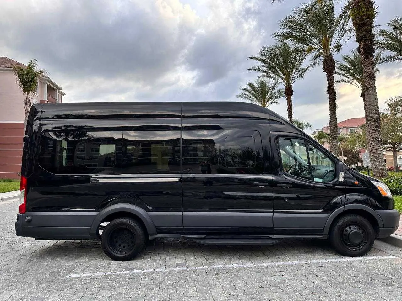 Black Ford Minibus with tinted windows for minibus rental
