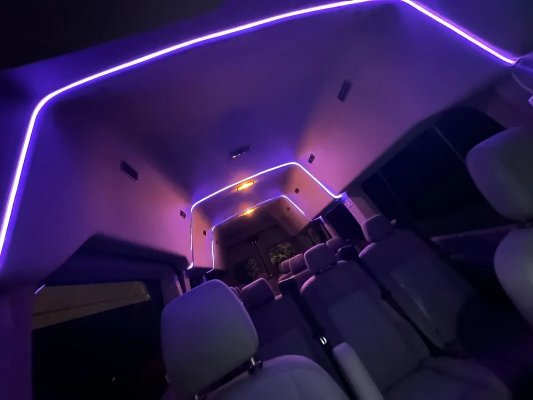 Ford Transit Van interior with high-roof cabin and LED ceiling lighting, photo 3 for minibus rental