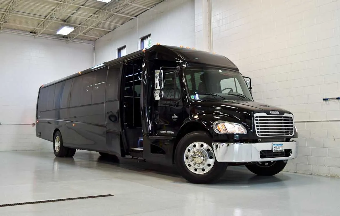 Black Freightliner Luxury Coach for charter bus rental in Toone, TN