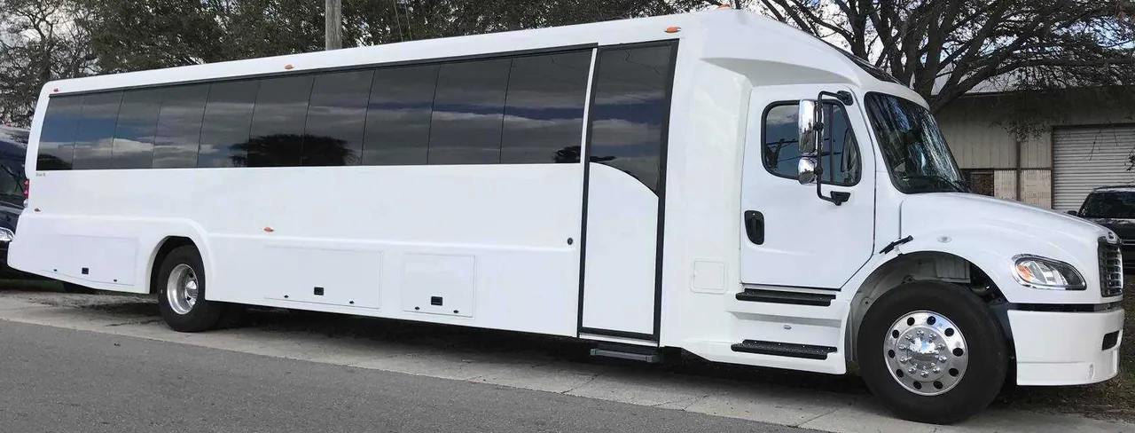 White Freightliner Luxury Coach for charter bus rental in Newton, MS