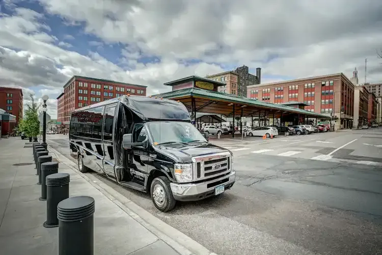 Black Grech Party Bus exterior with tinted windows for party bus rental