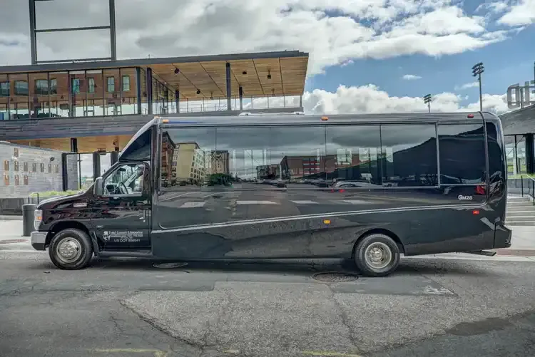 Black Grech Party Bus exterior with tinted windows, photo 4 for party bus rental