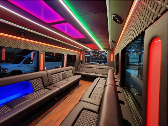 Limousine Bus Limousine Bus interior with perimeter lounge seating, LED accent lighting and LED ceiling lighting for party bus rental