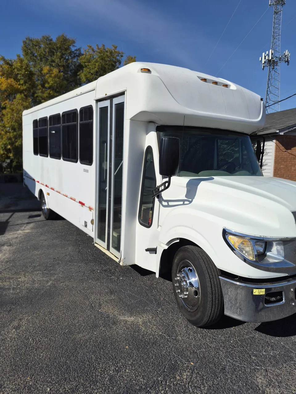 Silver Limousine Bus exterior with tinted windows, photo 4 for party bus rental