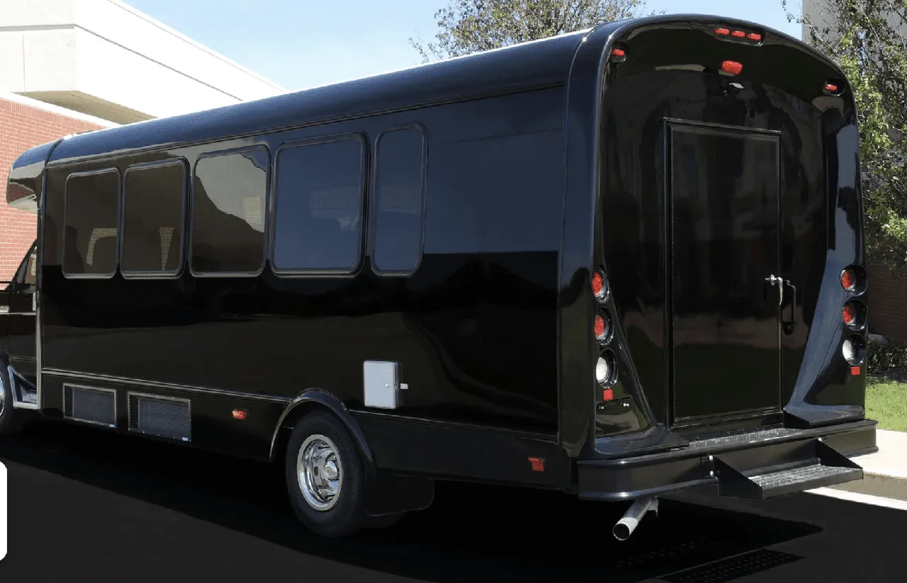 Black Limousine Coach exterior with tinted windows for party bus rental