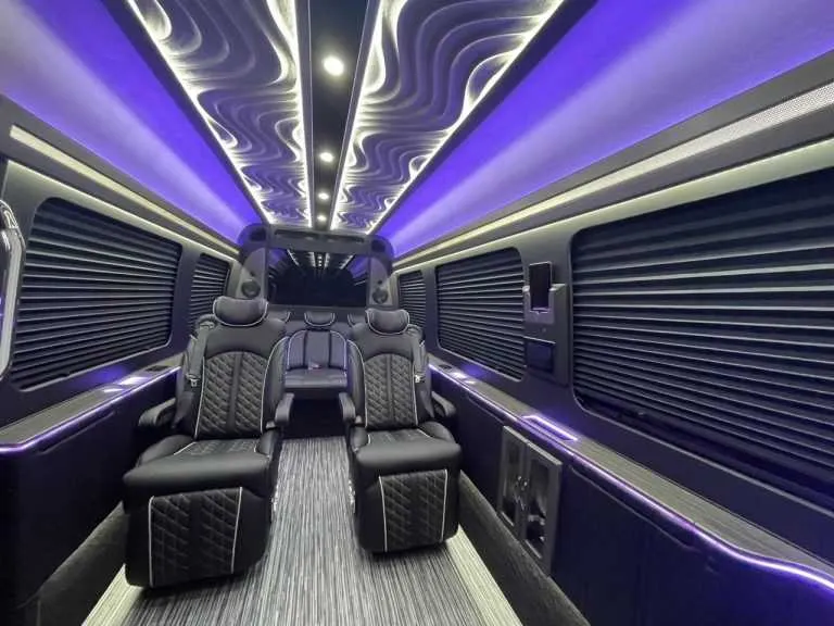 Luxury Mercedes-Benz Sprinter interior with captain's chairs, window shades and LED accent lighting, photo 5 for minibus rental