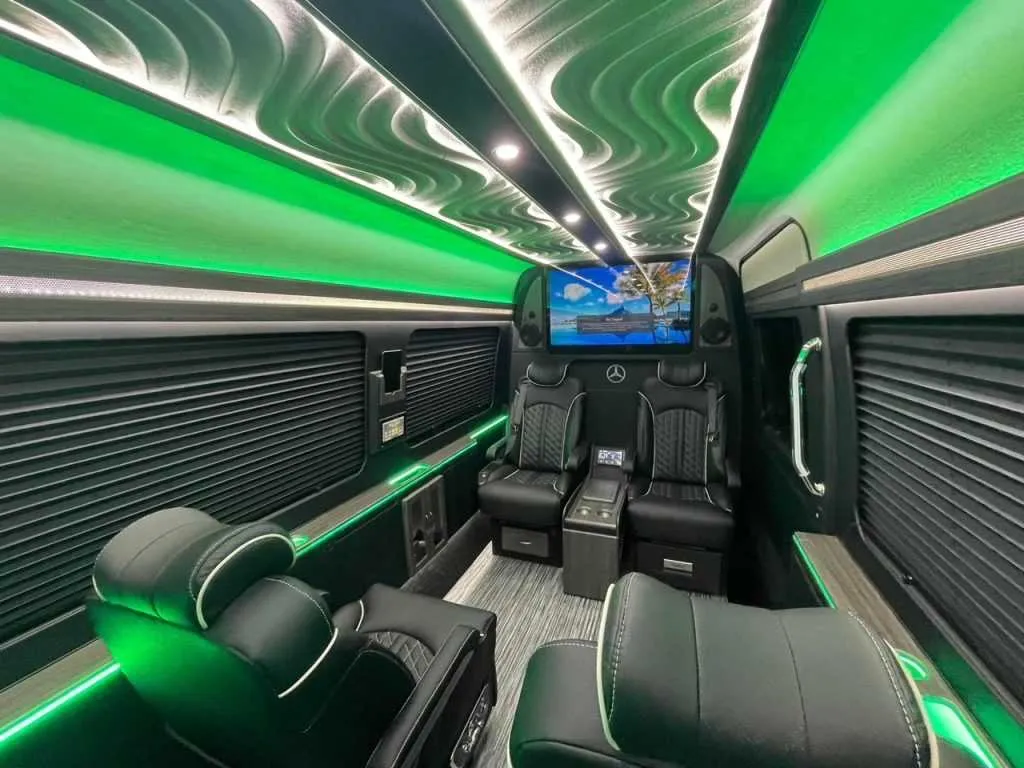 Luxury Mercedes-Benz Sprinter interior with captain's chairs, window shades and LED accent lighting, photo 6 for minibus rental