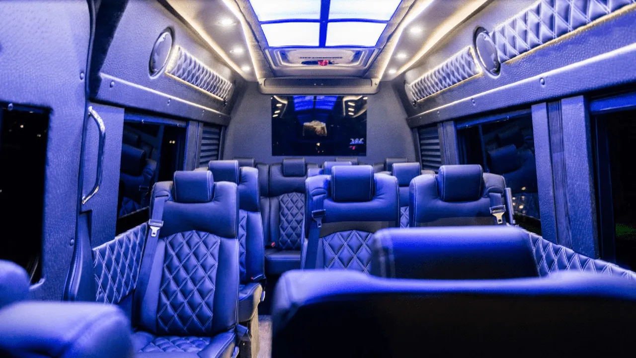 Mercedes-Benz Executive Sprinter Mercedes-Benz Executive Sprinter interior with captain's chairs, LED accent lighting and TV screens for minibus rental