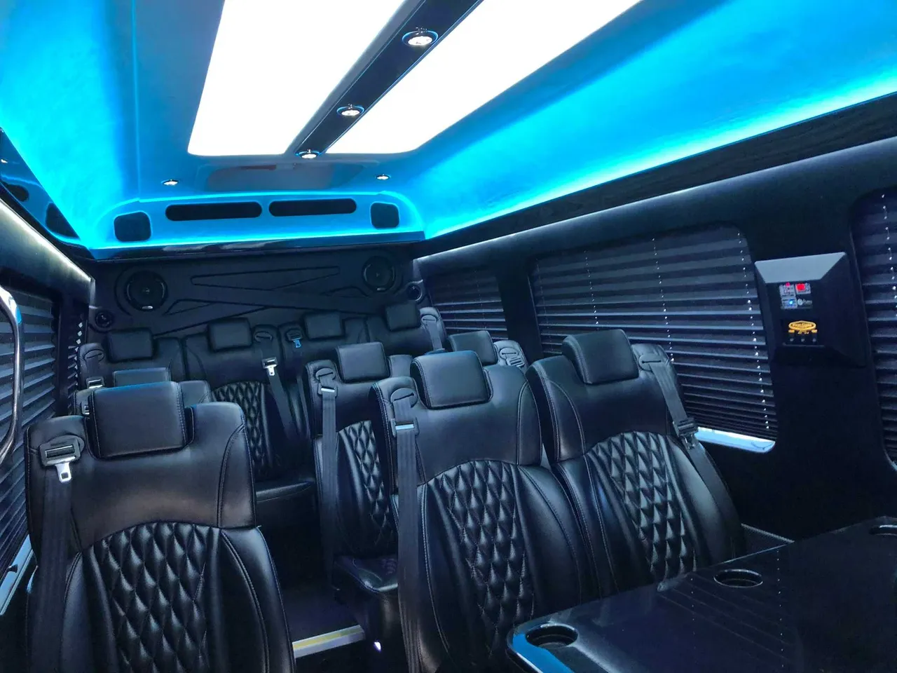 Mercedes Executive Sprinter interior with captain's chairs, passenger tables and window shades, photo 3 for minibus rental