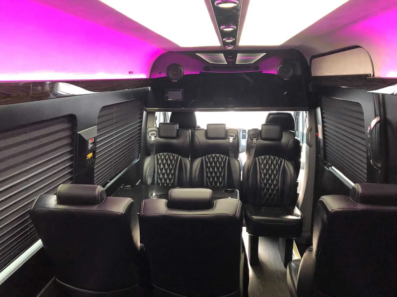 Mercedes Executive Sprinter interior with captain's chairs, window shades and LED ceiling lighting, photo 4 for minibus rental