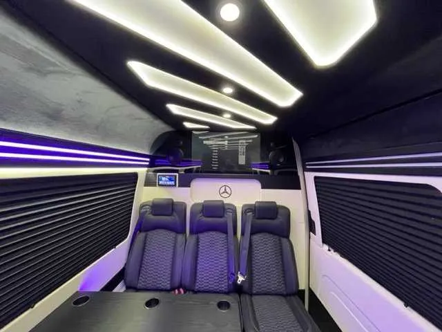 Mercedes-Benz Executive Sprinter interior with passenger tables, cup holders and window shades, photo 3 for minibus rental