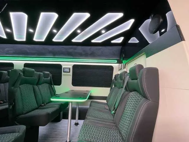 Mercedes-Benz Executive Sprinter interior with passenger tables, window shades and LED accent lighting, photo 4 for minibus rental