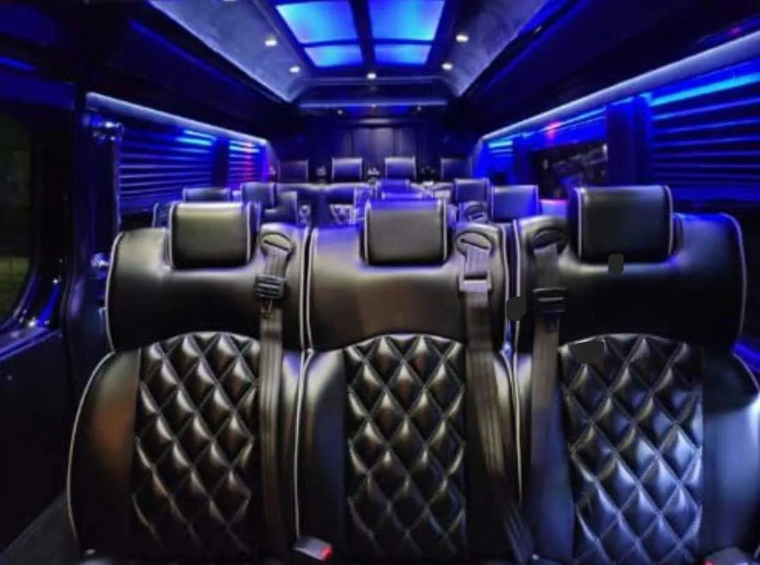Mercedes Executive Sprinter interior with captain's chairs, window shades and LED accent lighting for minibus rental