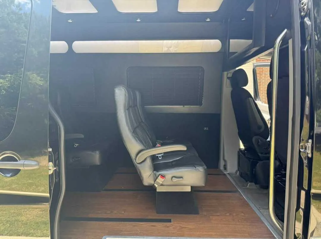 Mercedes-Benz Limousine Sprinter Mercedes-Benz Limousine Sprinter interior with LED ceiling lighting and wood-look flooring for minibus rental