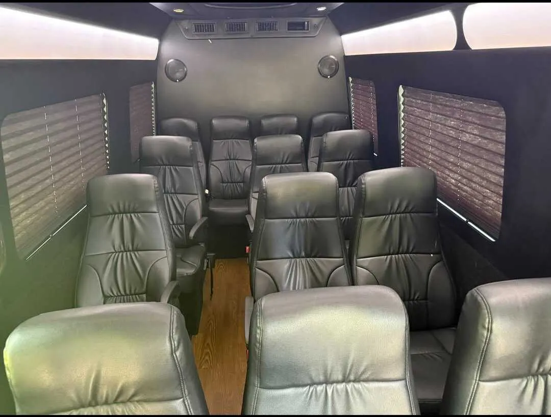 Mercedes-Benz Limousine Sprinter interior with captain's chairs, window shades and LED ceiling lighting for minibus rental