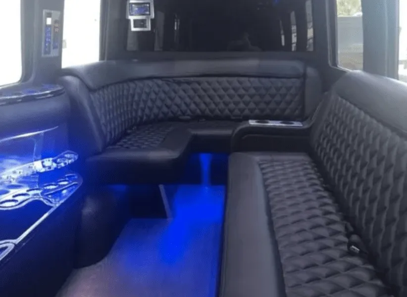 Mercedes-Benz Limousine Sprinter Mercedes-Benz Limousine Sprinter interior with sofa-style seating, cup holders and LED accent lighting for party bus rental