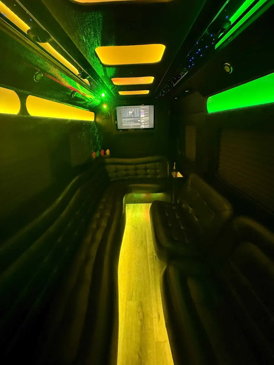 Mercedes-Benz Limousine Sprinter interior with perimeter lounge seating, LED accent lighting and LED ceiling lighting, photo 3 for party bus rental