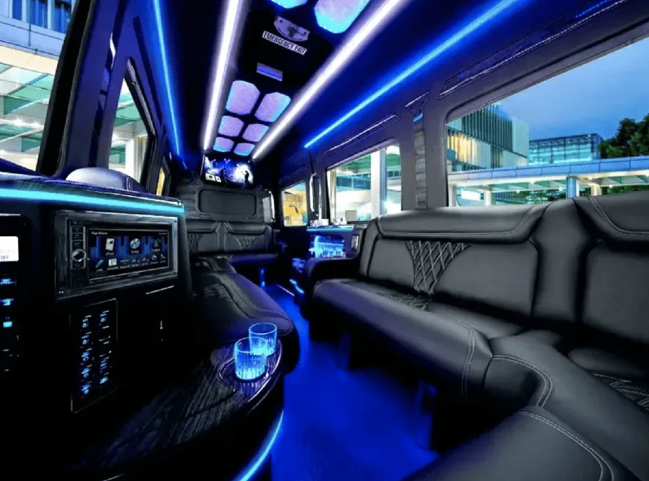 Mercedes-Benz Limousine Sprinter interior with sofa-style seating, LED accent lighting and LED ceiling lighting for party bus rental