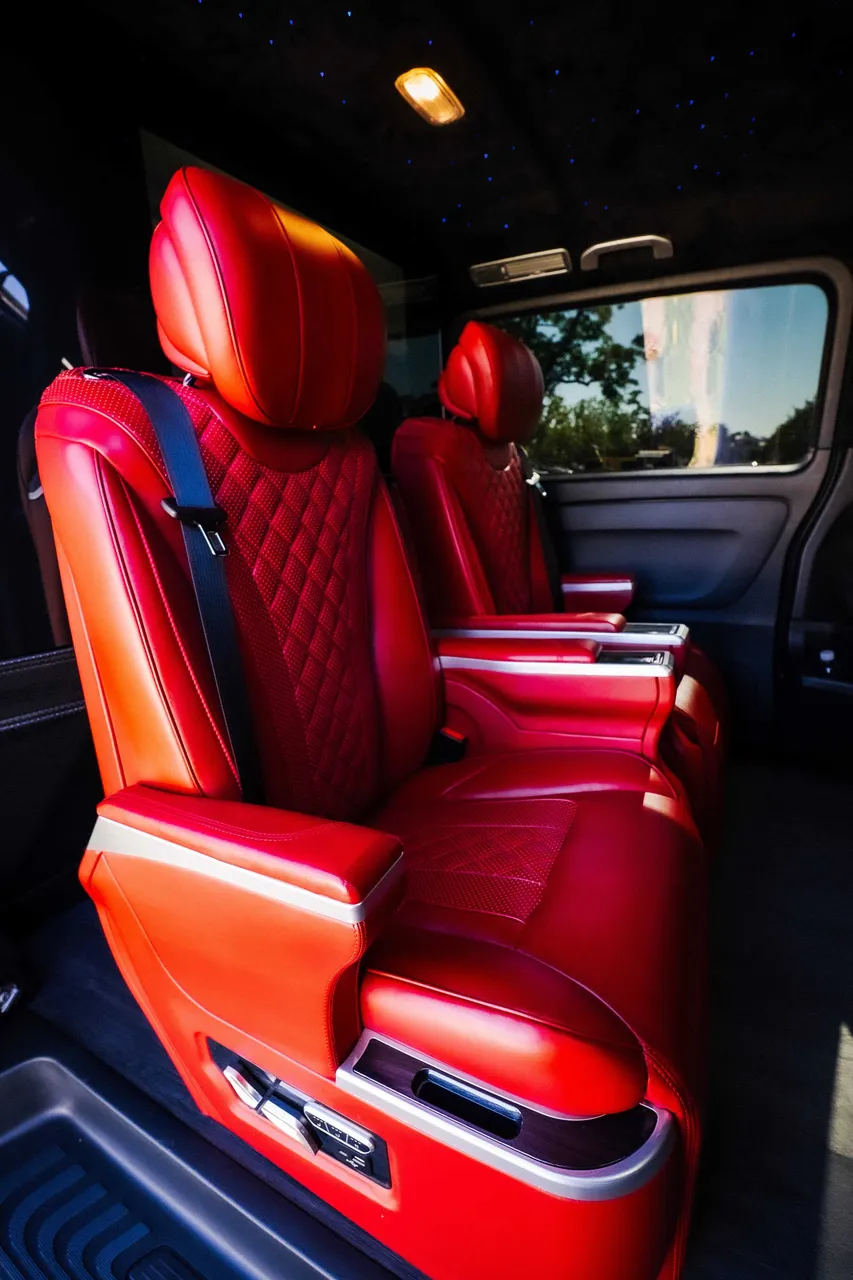 Mercedes-Benz Metris interior with captain's chairs and starlight or fiber-optic ceiling for minibus rental