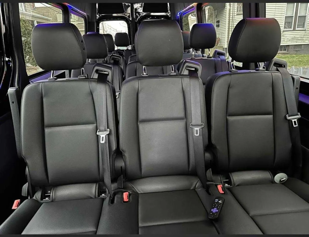 Mercedes-Benz Sprinter interior with passenger seat belts for minibus rental