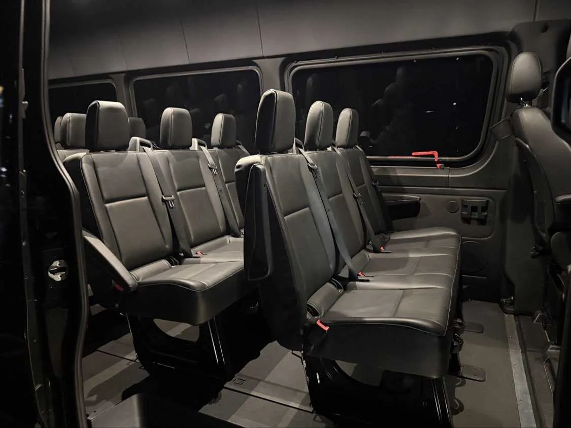 Mercedes Sprinter interior with passenger seat belts for minibus rental