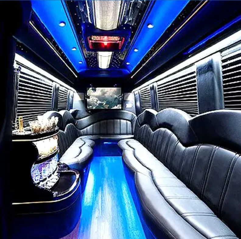 Mercedes-Benz Sprinter Limousine Mercedes-Benz Sprinter Limousine interior with perimeter lounge seating, sofa-style seating and window shades for party bus rental