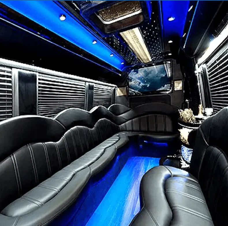 Mercedes-Benz Sprinter Limousine interior with perimeter lounge seating, window shades and LED accent lighting for party bus rental