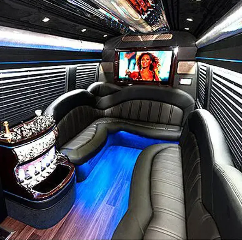 Mercedes-Benz Sprinter Limousine interior with perimeter lounge seating, window shades and LED accent lighting for party bus rental