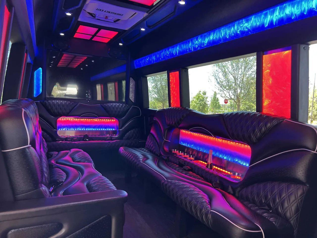 Mercedes-Benz Sprinter Limousine interior with sofa-style seating, LED accent lighting and LED ceiling lighting, photo 2 for party bus rental