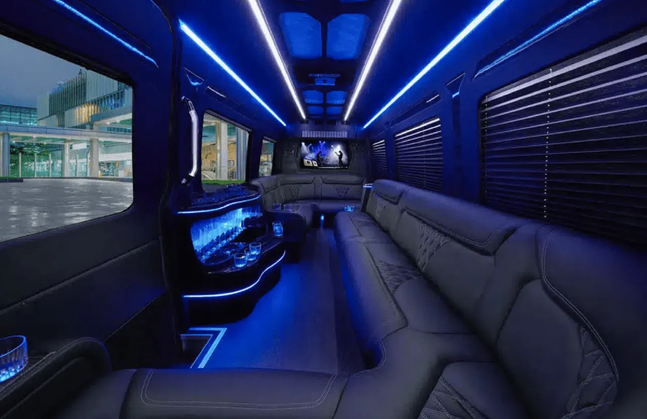 Mercedes-Benz Sprinter Limousine Mercedes-Benz Sprinter Limousine interior with perimeter lounge seating, window shades and LED accent lighting for party bus rental