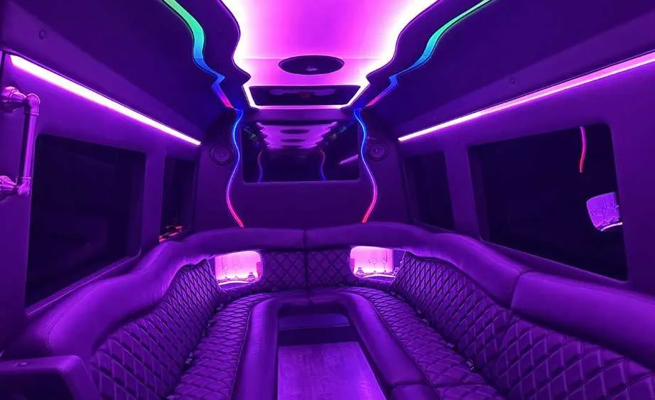 Mercedes-Benz Sprinter Limousine Mercedes-Benz Sprinter Limousine interior with perimeter lounge seating and LED accent lighting for party bus rental