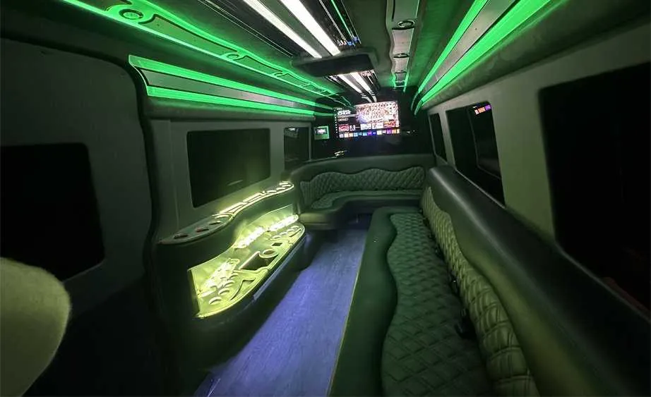 Mercedes-Benz Sprinter Limousine interior with perimeter lounge seating, LED accent lighting and bar area, photo 4 for party bus rental
