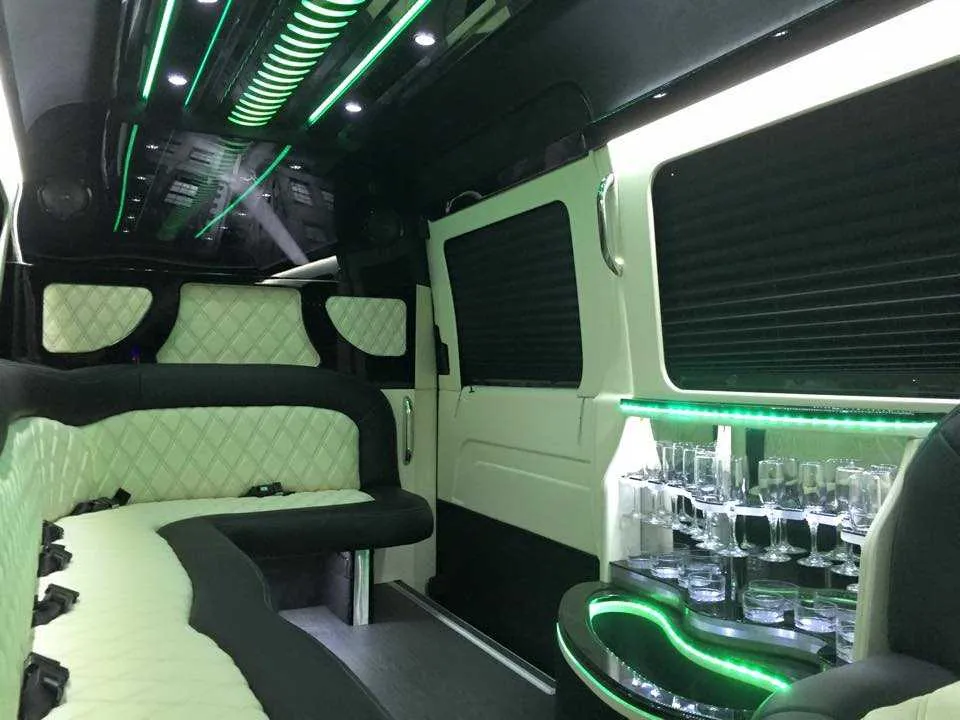 Mercedes-Benz Sprinter Limousine interior with perimeter lounge seating, sofa-style seating and window shades, photo 2 for party bus rental
