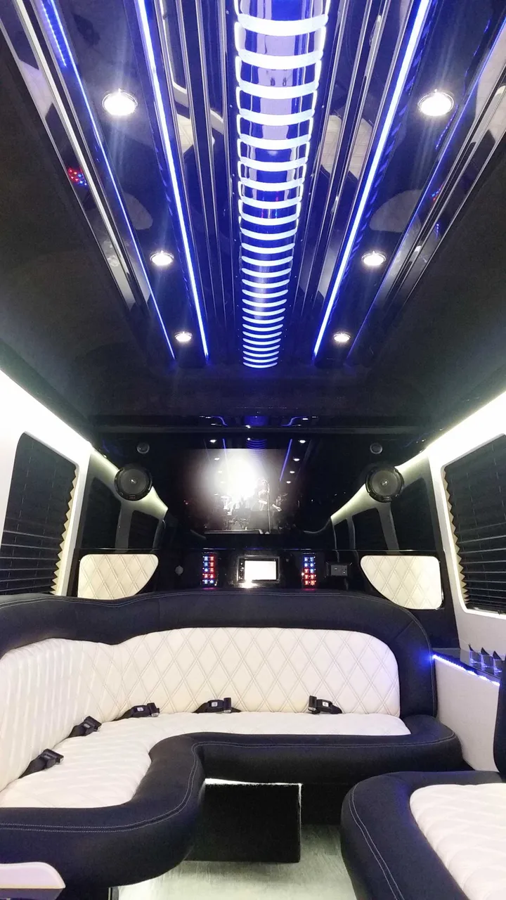 Mercedes-Benz Sprinter Limousine interior with perimeter lounge seating, sofa-style seating and window shades, photo 3 for party bus rental