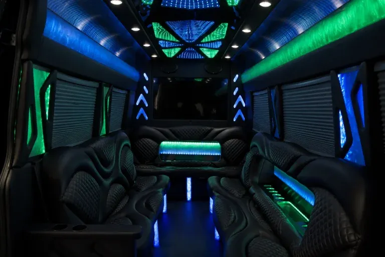 Mercedes-Benz Sprinter Limousine Mercedes-Benz Sprinter Limousine interior with perimeter lounge seating, window shades and LED accent lighting for party bus rental