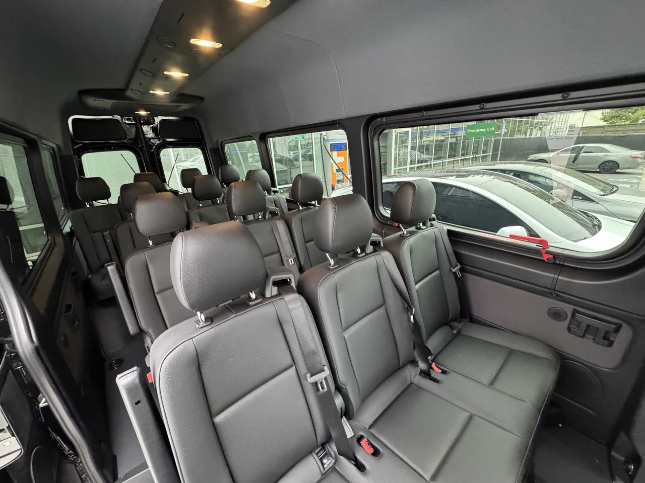 Mercedes Sprinter Van interior with passenger seat belts for minibus rental