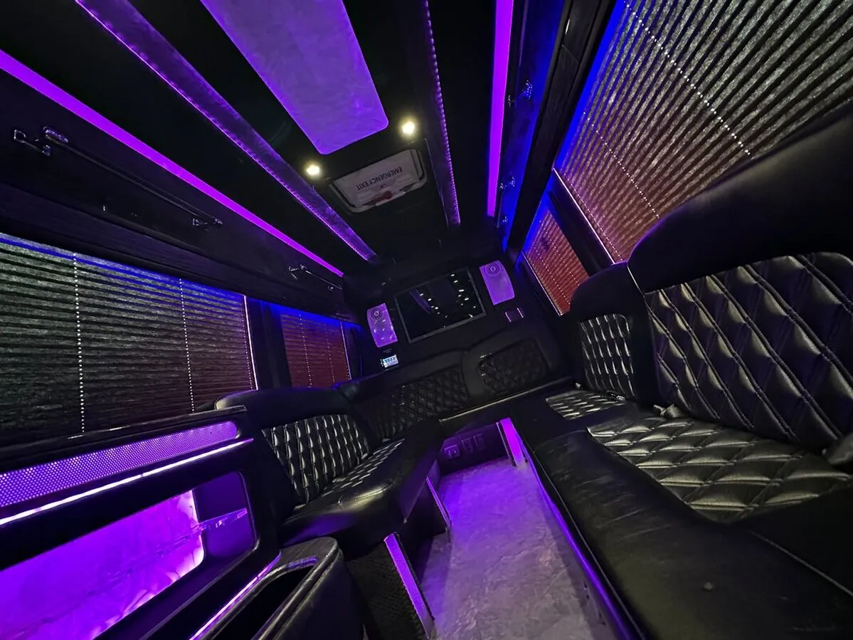 Mercedes-Benz Sprinter XL interior with perimeter lounge seating, window shades and LED accent lighting, photo 4 for party bus rental