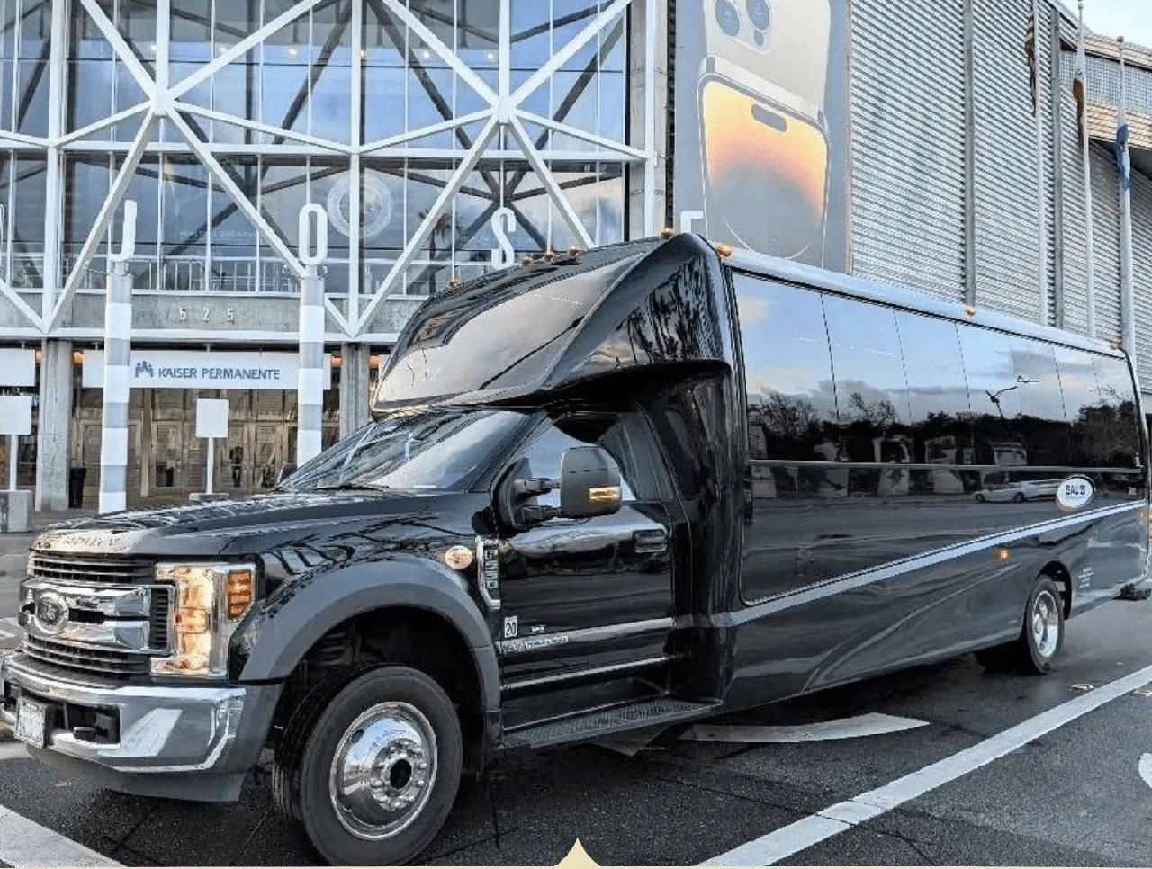 Black 27 Passenger Mini Coach with tinted windows for minibus rental