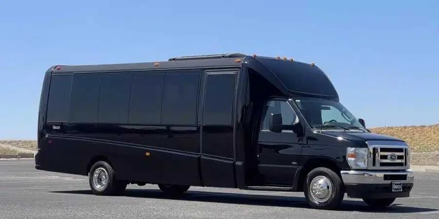Black Ford F550 Executive Mini Bus with tinted windows for minibus rental