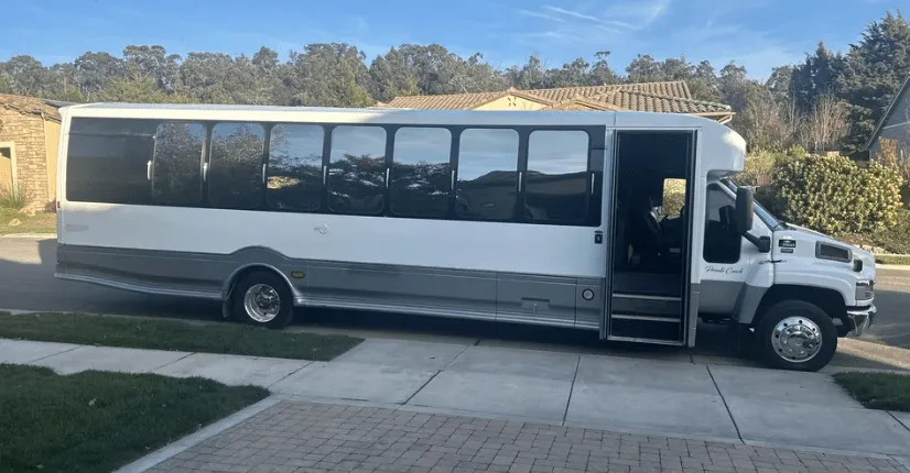 Silver 25 Passenger Mini Coach with tinted windows for minibus rental