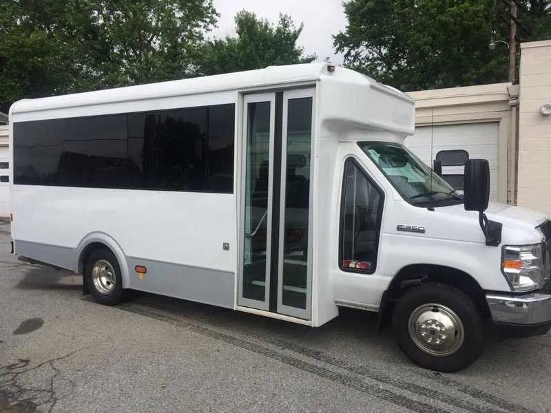 White 14 Passenger Mini Coach with tinted windows for minibus rental