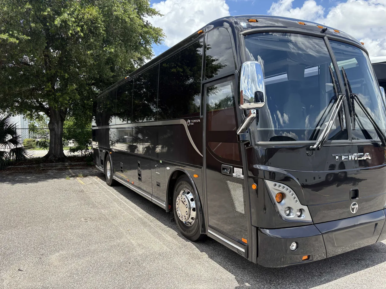 Black 40 Passenger Mini Coach with tinted windows for minibus rental