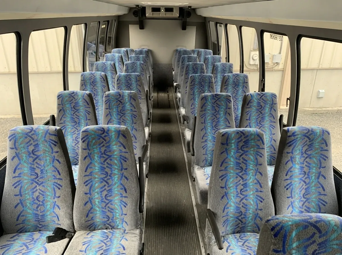 31 Passenger Mini Coach in black, available to rent